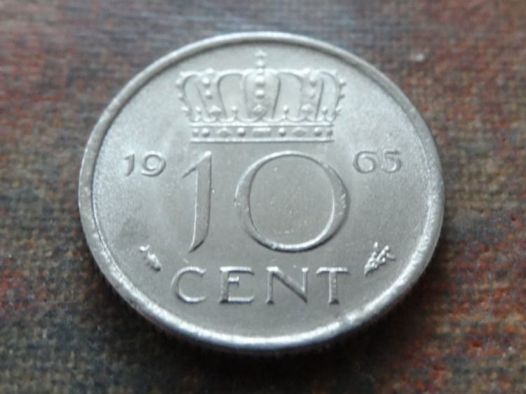 Tutti le monete: PAYS-BAS  Nederland  10  Cent  1965 – Usato da Romanel-sur-Lausanne venduto da Swift13