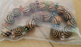 15). Armband
