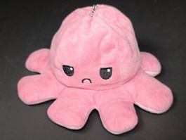 Peluche pieuvre réversible rose exprimant des émotions