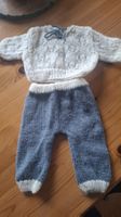 Handgestrickte Puppenkleider