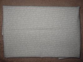 Baumwollstoff beige mit weisser Schrift Reststück!
