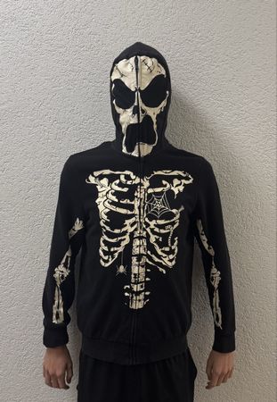 Hoodie à capuche squelette phosphorescente. Taille 14 ans