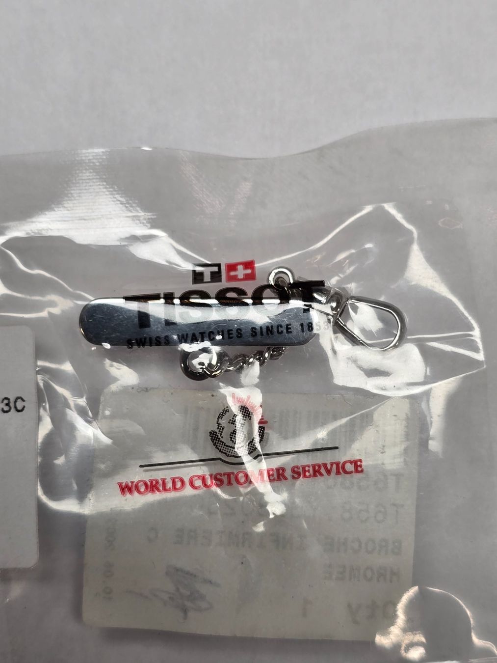 Tissot Sonstiges Uhren Zubehör: Broche d'infirmière chromee pour montre – Neu und originalverpackt aus Tramelan von Nirdan 2