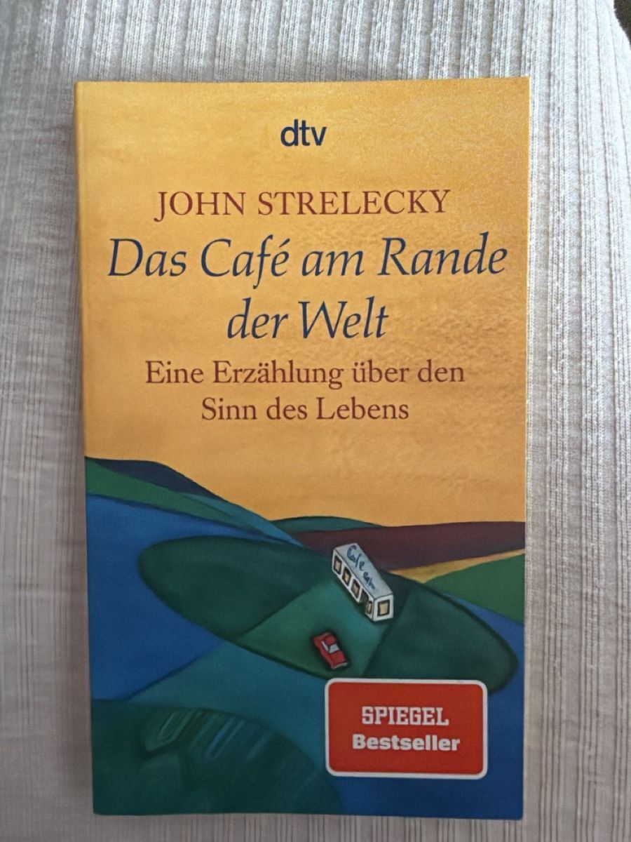 Libri: Buch John Strelecky - Das Café am Rande der Welt – Nuovo (secondo la descrizione) da Ossingen venduto da dascha_fej