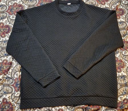 Schwarzes gestepptes Herren-Sweatshirt aus Polyester.
