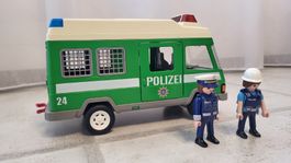Polizeibus mit 2 Figuren
