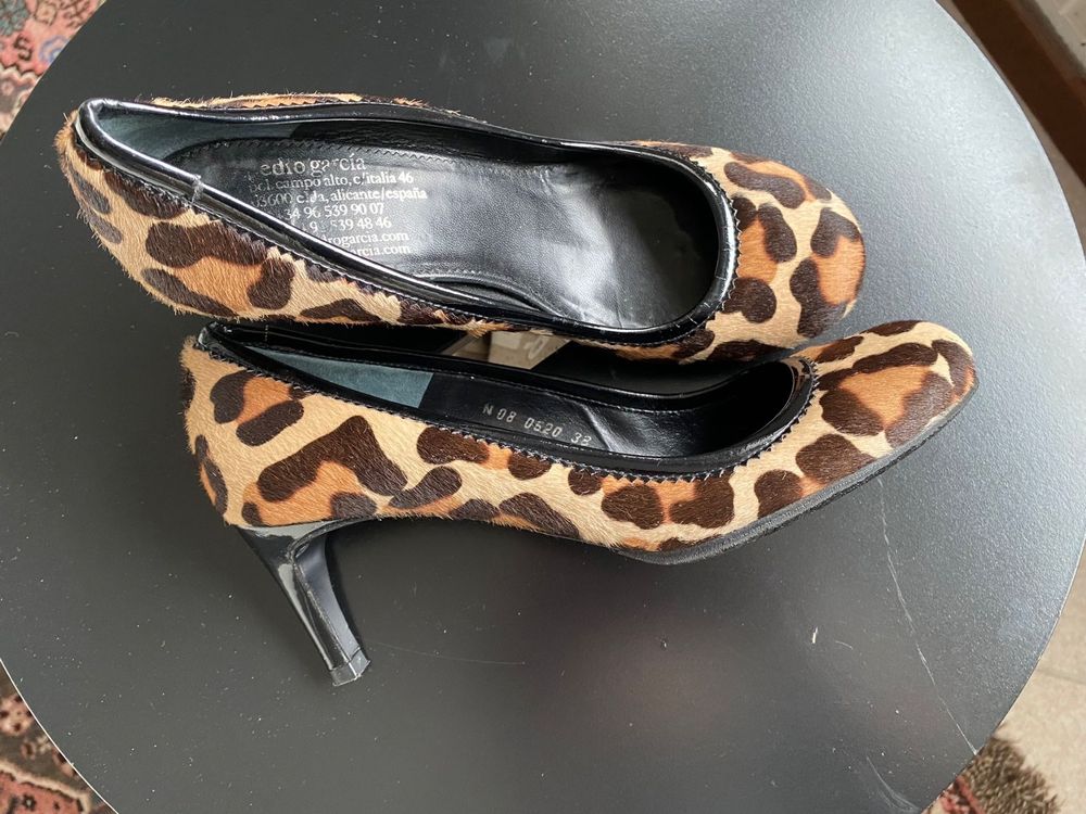 Designer best sale leopard pumps