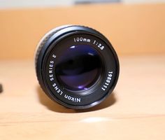 Objektiv Nikon Series E 100mm 1:2.8,  top! Made in Japan