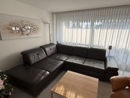 Elegante Leder-Wohnlandschaft mit Relax- & Bettfunktion