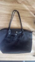Sac cabas Longchamp noir pliable état d'usage