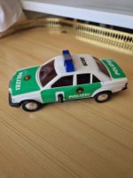 Spielzeugauto Mercedes 190 mit Schwungrad Polizei - Batteri