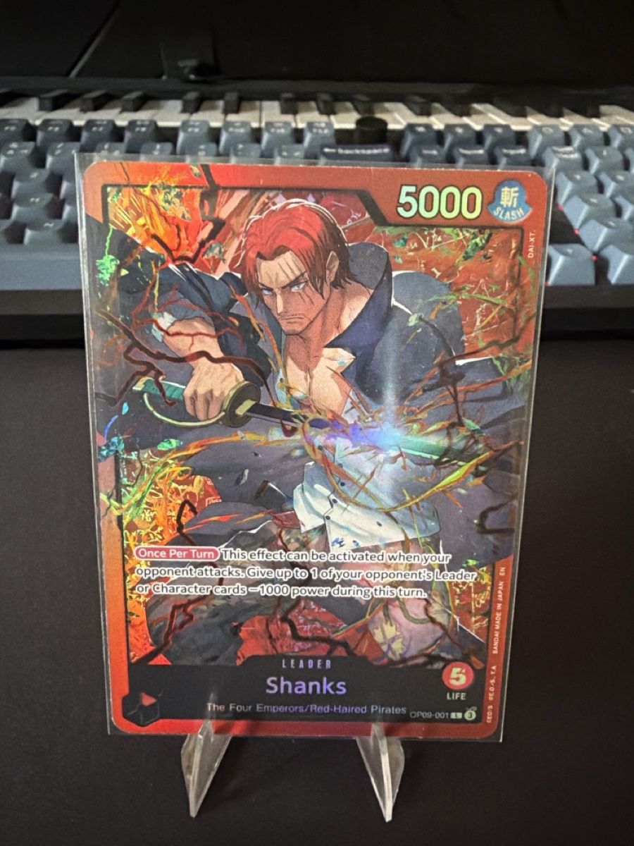 Bandai Carte collezionabili: One Piece Karte Shanks Holo – Nuovo (secondo la descrizione) da Kriens venduto da Ajiani