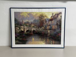Gerahmtes Puzzle Thomas Kinkade Kopfsteinpflaster-Haus 80x60