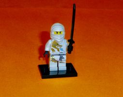 Lego Ninjago/Minifigur njo0018 Zane DX m. Waffe+Standplatte
