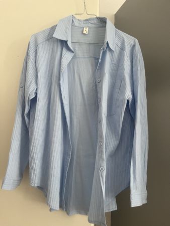 Chemise bleu ciel taille L femme état neuf