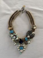Statement necklace with mixed charms and stones