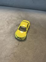 Modellauto BMW M Performance gelb Massstab 1:64 gebraucht