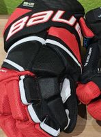 Gants de hockey Bauer rouge et noir légèrement utiliser.