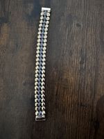 Schickes Armband, schwarz/gold