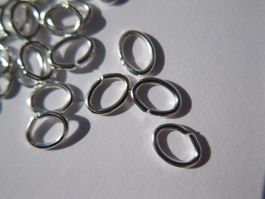 200 Spaltringe, Binderinge versilbert, oval 5 x 3,5 /0,5mm