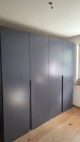 A designer solid wood four-door gray wardrobe