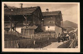 Rueras, Strasse mit Holzhäusern, Bauer 
