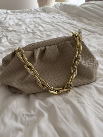Stylish beige woven clutch with golden chain strap!