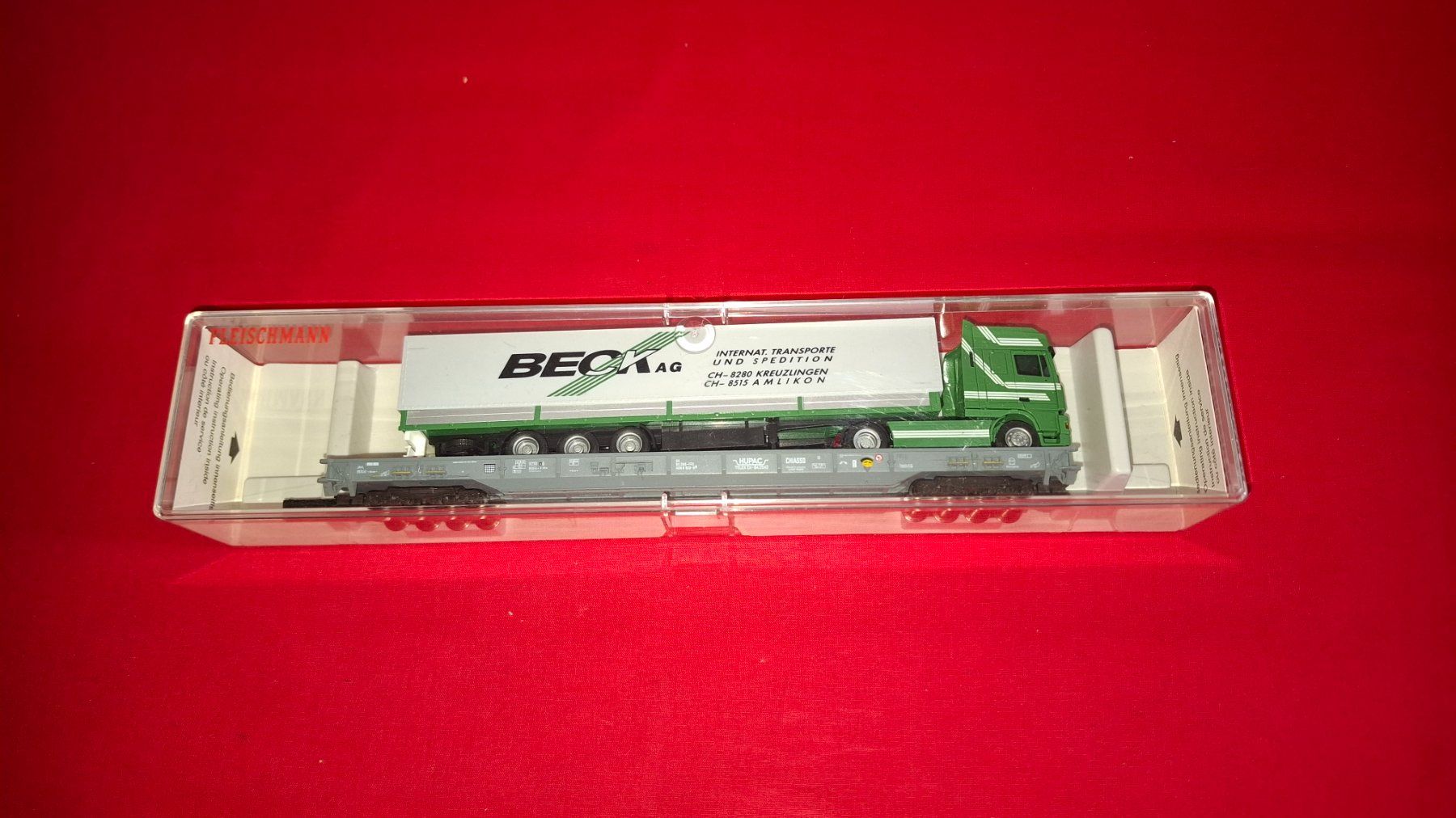 Fleischmann Modellini di ferrovie: Fleischmann : Hupac - Wagen mit Sattelschlepper " Beck " – Nuovo (secondo la descrizione) da Märwil venduto da Siebenzipfel 2
