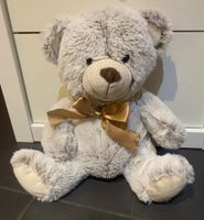 MIGROS Teddybär hellbraun mit Schleife