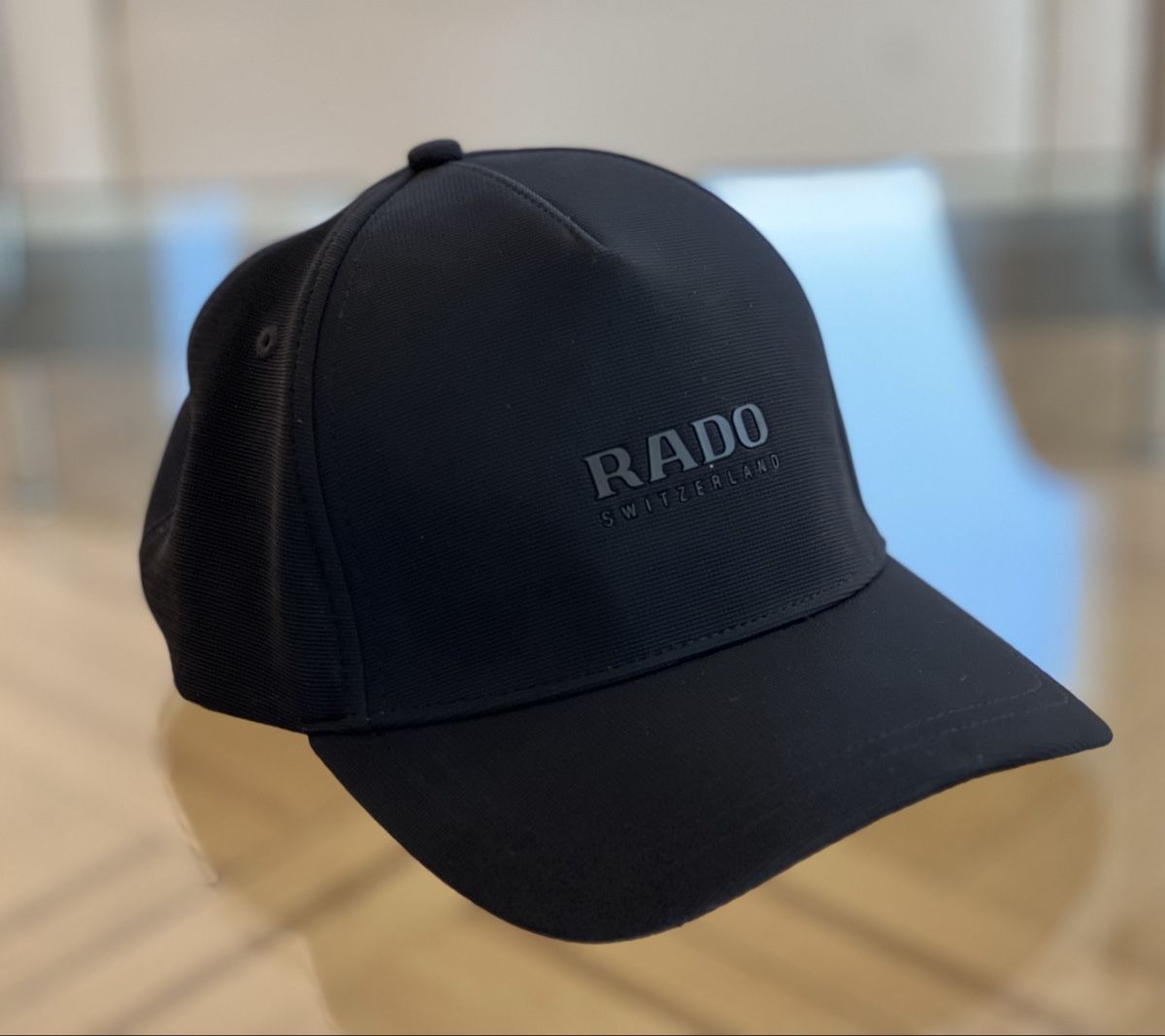 Rado Montres: Casquette Rado – Neuf avec emballage d'origine à Orbe par Watchivore