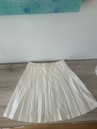 White pleated skirt