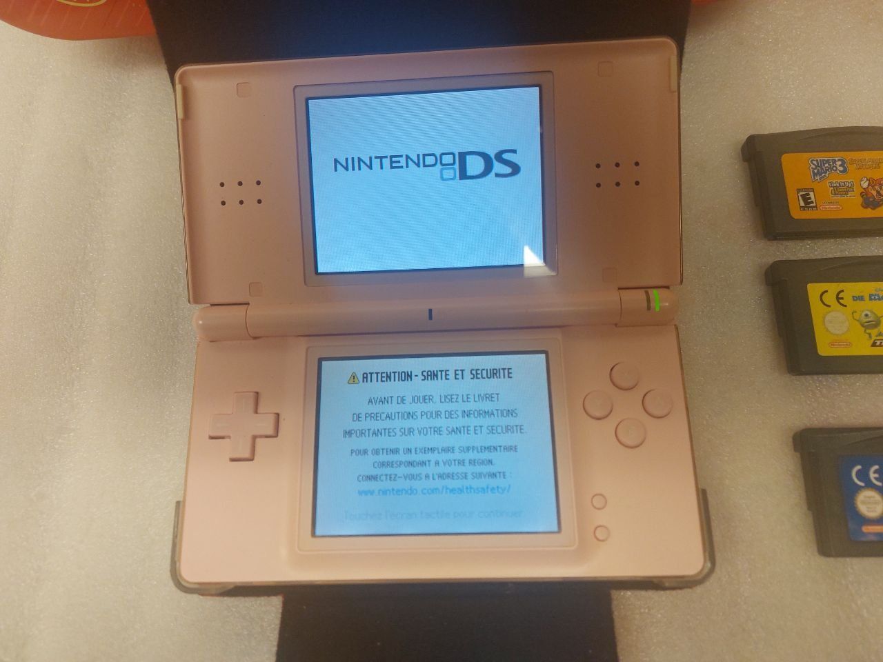 Nintendo Consoles: Konsolle Pink DS Lite Nintendo + 5 Jeux + ..... – D'occasion à Pambio Noranco par Pol69 1