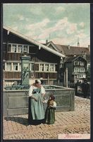 Appenzell, Appenzellerin in Tracht mit E