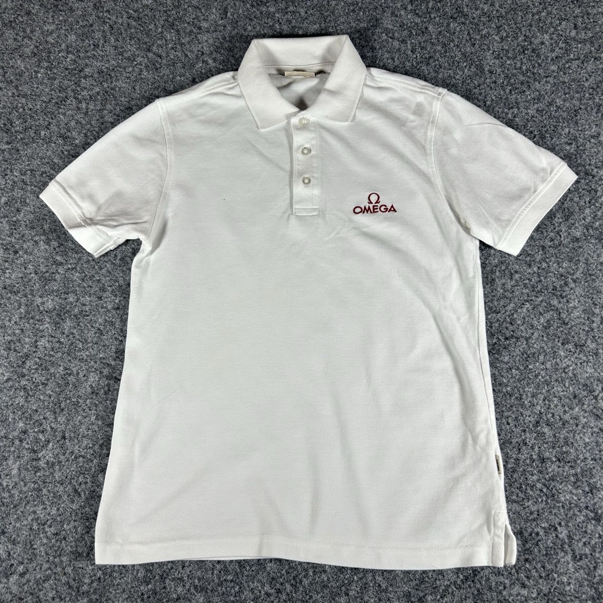 Magliette Polo: Oméga polo – Usato da La Sagne NE venduto da Matlasape