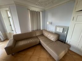Beige leather L- shaped couch