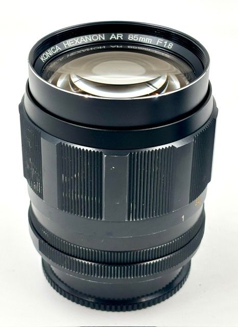 Konica Obiettivi: Konica Hexanon AR 85mm F1.8 / 1.8 EE-Version + Insekt? – Usato da Seewis Dorf venduto da Plebejus 2