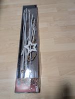 Winterliche Deko-Tanne aus Ästen mit Stern