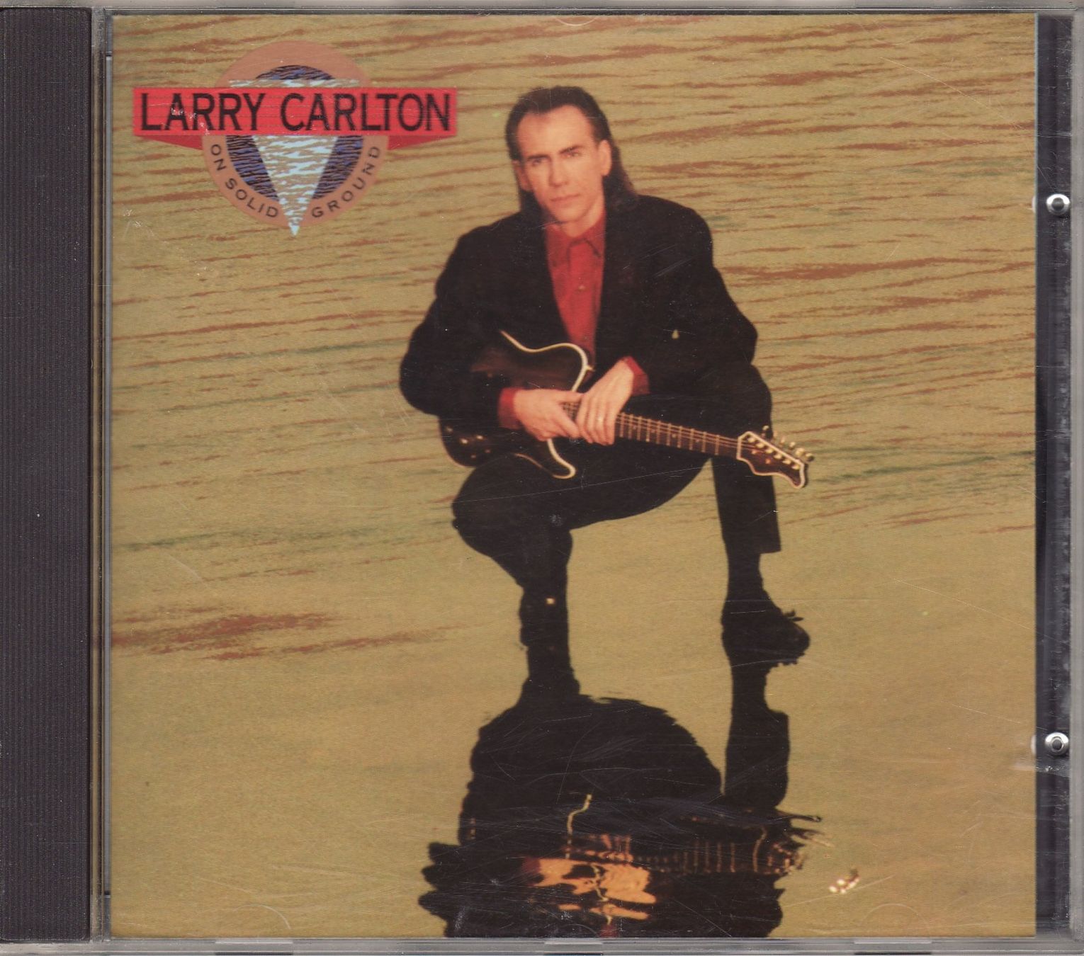 CD: Larry Carlton – On Solid Ground – Nuovo (secondo la descrizione) da Boussens venduto da catfood01