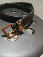 Ceinture Saint Laurent cuir noir boucle dorée