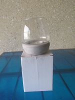 Windlicht aus Glas und Zement
