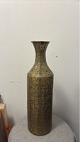Ornate brass vase with cut-out pattern