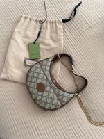 Gucci GG half-moon-shaped mini bag