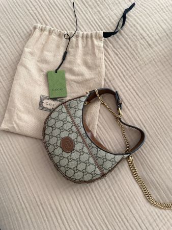 Gucci GG half-moon-shaped mini bag