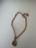 Guess Armband G-Anhänger mit Stern und Stein Rosegoldfarben