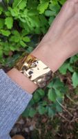 Bracciale rigido dorato leggero effetto martellato