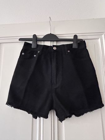 Black frayed denim shorts