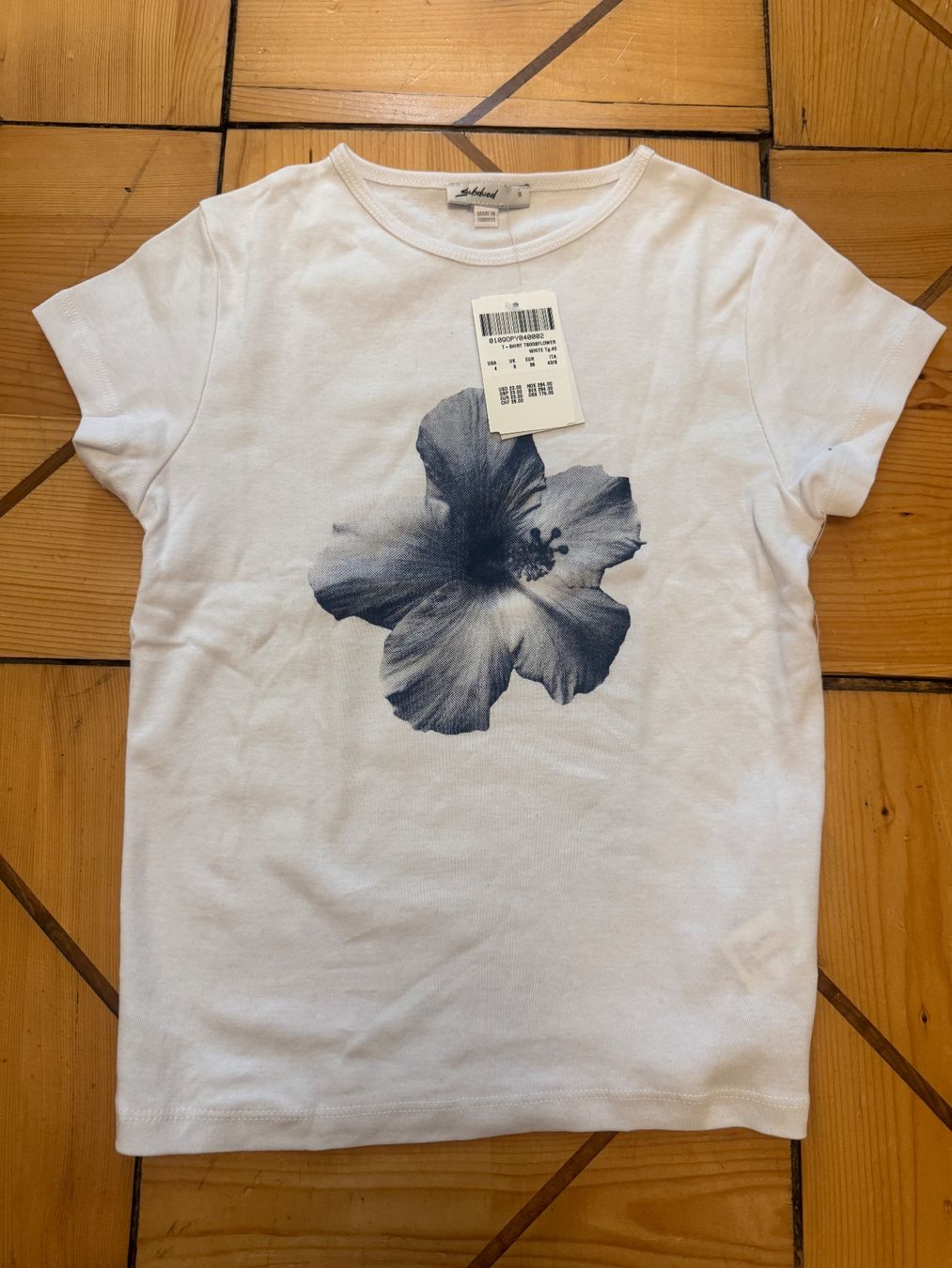 T-shirt: Subdued Printed T-Shirt – Nuovo (secondo la descrizione) da Zürich venduto da catemiranda 1