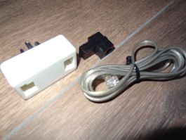 Adaptateur téléphonique et câble