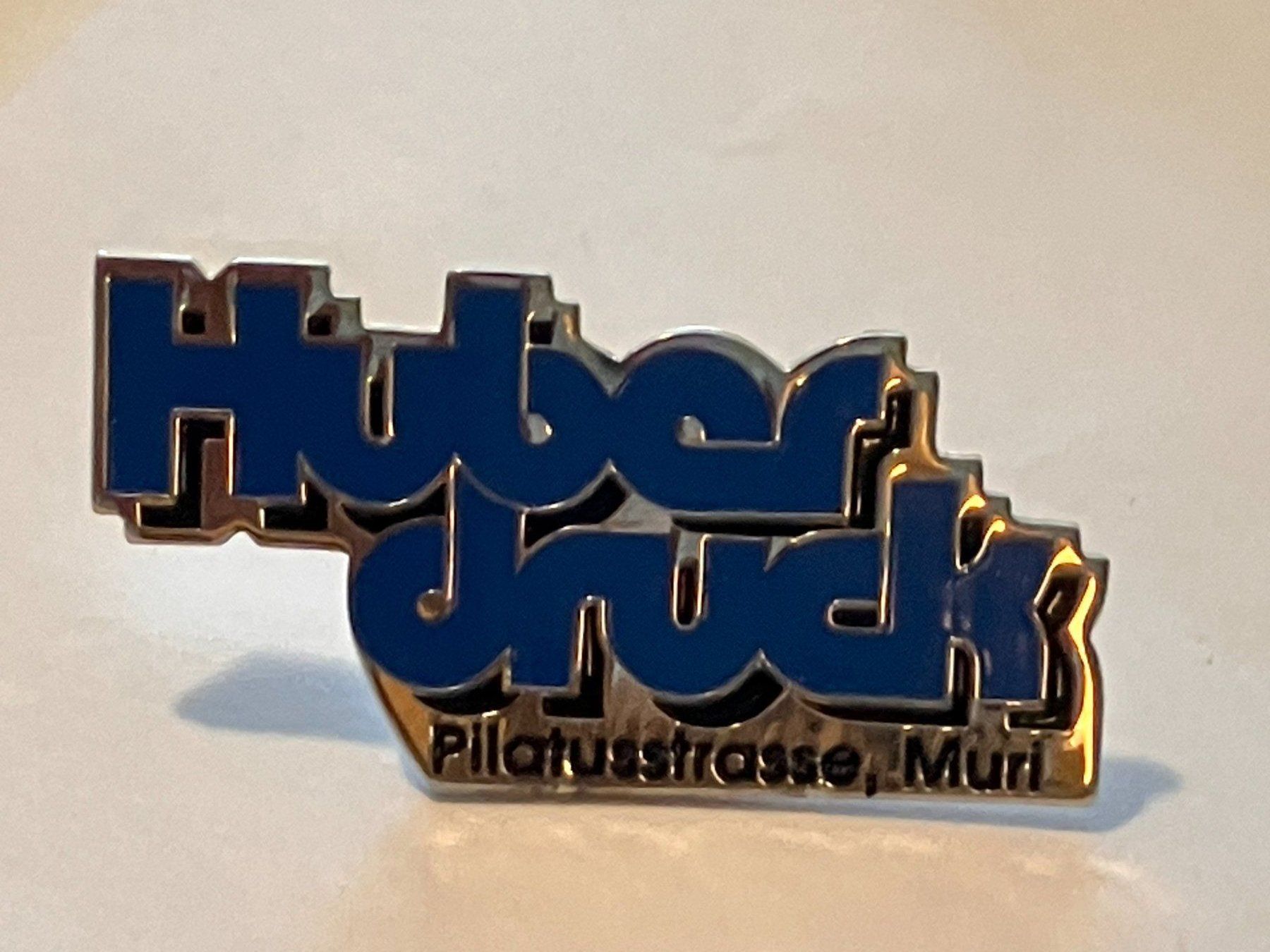 Placchette & Badge: 1 Pin Huber Druck Muri – Usato da Basel venduto da djwwpp