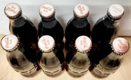 8 Coca-Cola Flaschen Last Edition 1999, deutsche Sprüche